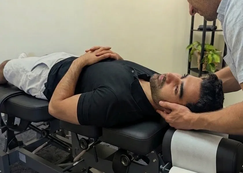 Dr Simon Hardy performing chiropractic treatment on a patient at Bassendean Chiropractic, Morley